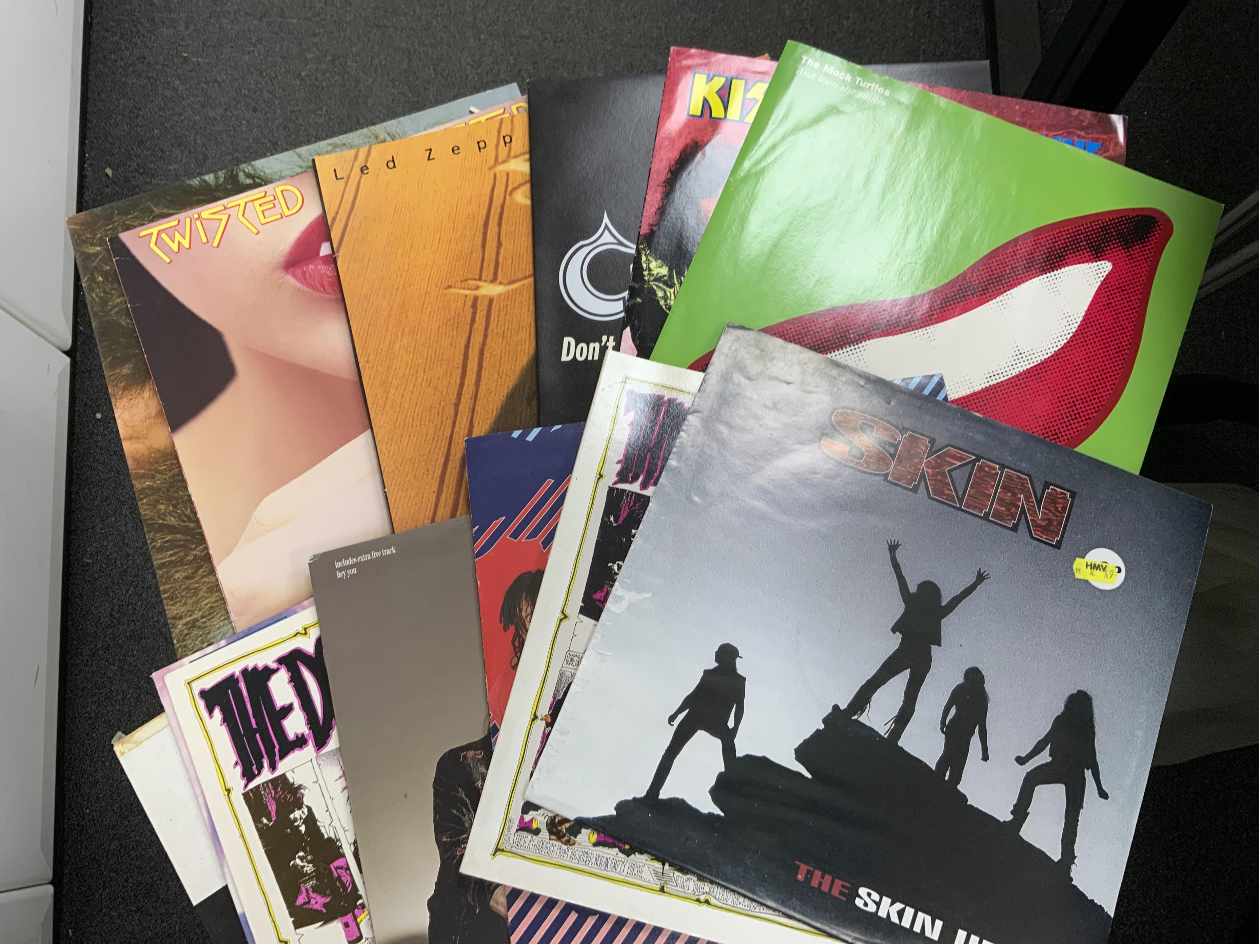 Sixty LP record albums, 12” singles, compilations, etc. artist including; Quireboys, Led Zeppelin, T’Pau, Mötley Crüe, Yes, Manic Street Preachers, Bon Jovi, etc. Condition - fair to good